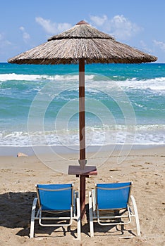 Empty sunbeds at tropical beach