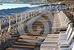 Empty sunbeds and umbrellas on a hotel beach