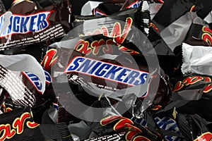 Empty sweet wrappers of Snickers and Mars candy bars