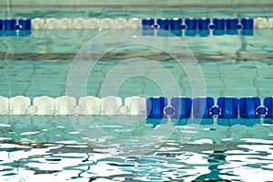 Empty swimming pool with blue and white lane dividers