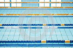 Empty, swimming pool or lines in water for competition or racing lanes for fitness or underwater sports. Background