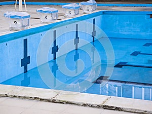 Empty swimming pool with swimming starting blocks