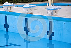 Empty swimming pool with swimming starting blocks