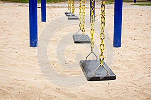 Empty swing on children playground