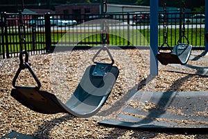 Empty Swing at Riverside city park playground