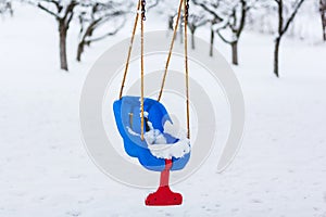 Empty swing in winter