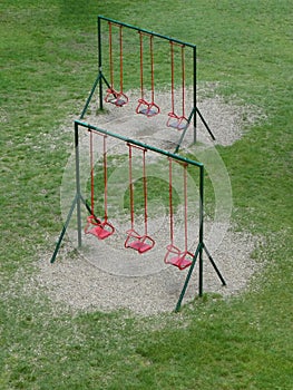 Empty swings in children playground