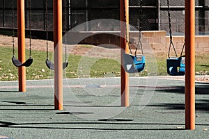 Empty swingset on a sunny playground