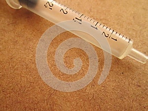 An Empty Syringe With Numbers.