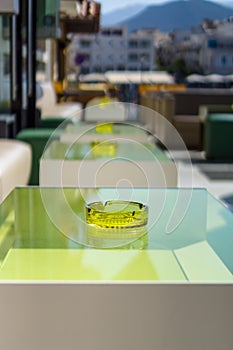 An empty table with an ashtray
