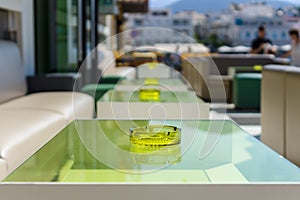 An empty table with an ashtray