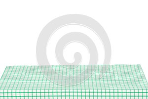 Empty table background. Empty wooden deck table covered with green white checkered tablecloth isolated on a white background.