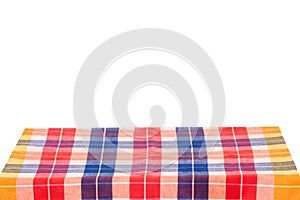 Empty table background. Empty wooden deck table covered with multicolored checkered tablecloth isolated on a white background.