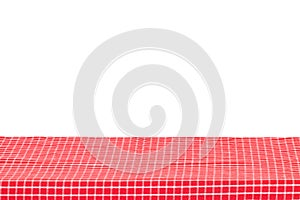 Empty table background. Empty wooden deck table covered with red white checkered tablecloth isolated on a white background. Space