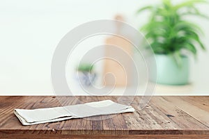 empty table board and defocused modern kitchen background. product display concept