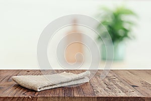 empty table board and defocused modern kitchen background. product display concept