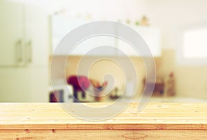 Empty table board and defocused white retro kitchen background