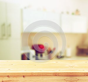 Empty table board and defocused white retro kitchen background