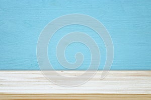 Empty table in front of blue wooden background. For product display montage