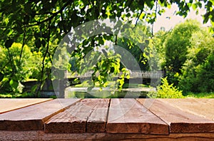 Empty table in front of dreamy countryside background