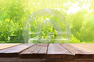 Empty table in front of dreamy countryside background