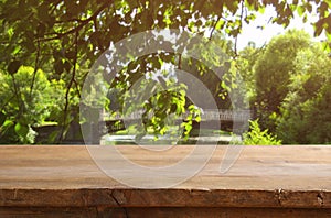 Empty table in front of dreamy countryside background