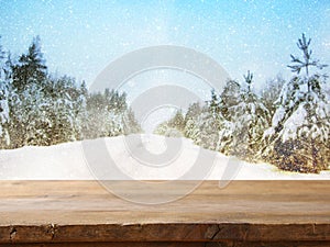 Empty table in front of dreamy winter landscape background