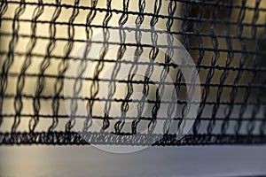 empty table with grid black mesh tabletennis, table tennis net in a blue ping pong table. photo