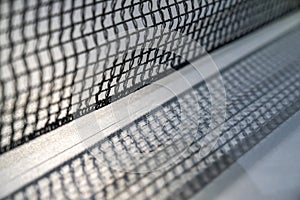 empty table with grid black mesh tabletennis, table tennis net in a blue ping pong table. photo