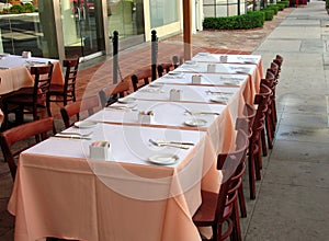 Empty Table With Place Settings at a Street CafÃ©