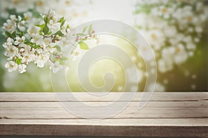 Empty table for product display with flower spring blur background