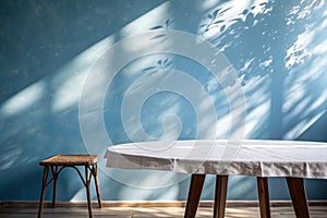 Empty table on smooth blue wall background