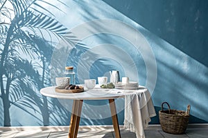 Empty table on smooth blue wall background