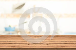 Empty table top on blurred background from kitchen room,space for