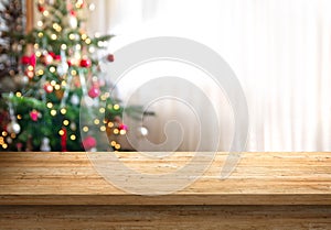 Empty table top and christmas tree in background