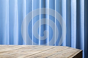 Empty table top with office blue blinds for montage your product