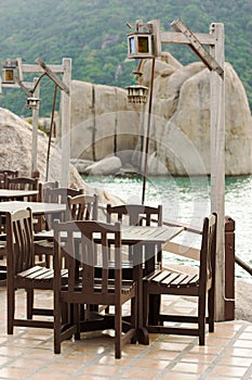 Empty tables in a cafe on the island of Koh Tao