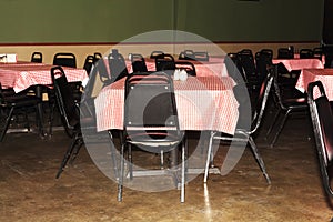 Empty Tables and Chairs At Inexpensive Restaurant