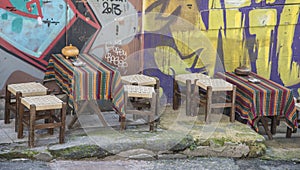 Empty tables and chairs outside of the restaurant in old city.