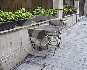 Empty tables and chairs outside of the restaurant in old city.