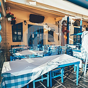 Empty tables in greek cafe on Crete Island, Greece