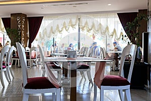 empty tables in the restaurant hall, waiting for visitors