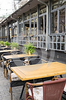 Empty tables in street cafe, chairs in street reastaurant
