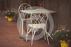 Empty tables in street. old street restaurant. the old table and chairs in the coffee shop.