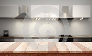 Empty tabletop over defocused kitchen with copy space