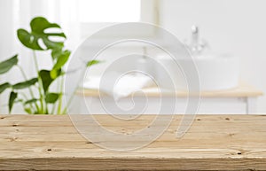 Empty tabletop for product display with blurred bathroom interior background