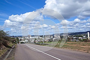 Empty Tarmac Road with View of Industrial Area