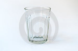 Empty tea glass isolated on white background