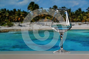 Empty Teku Beer Glass Tropical Background photo