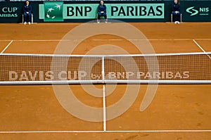 empty tennis clay court with net and judges